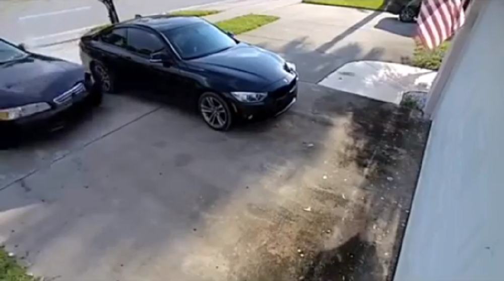 BMW almost hit by drifting car pulling up